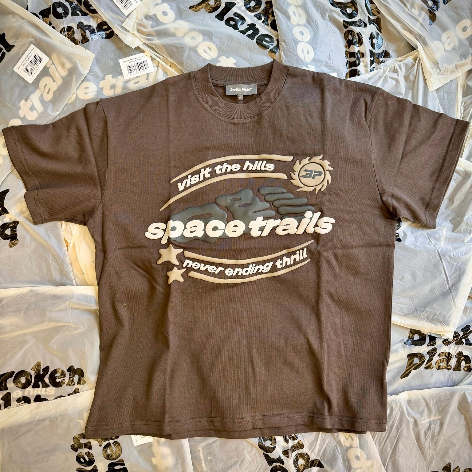 Broken Planet Market Space Trails T-Shirt Mocha Brown by Broken Planet Market in Clothing. Available at KershKicks for £76.50. A must-have for fans of Broken Planet Market looking to elevate their style with this T-Shirt.