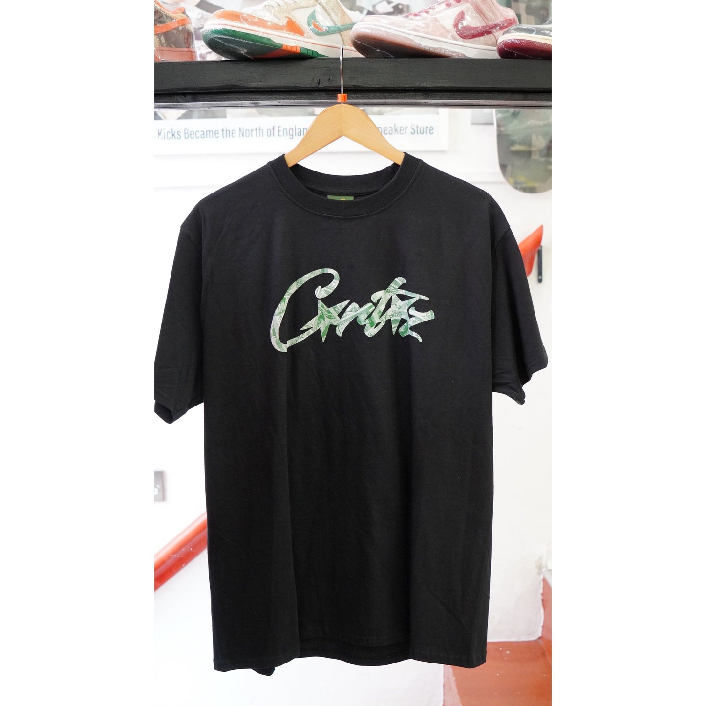 Corteiz Dollar Tee Black by Corteiz in . Available at KershKicks for £85.00. A must-have for fans of Corteiz looking to elevate their style with this T-Shirt.