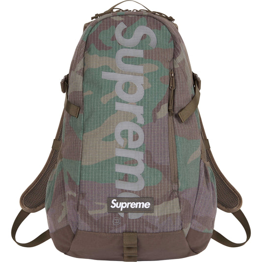 Supreme Backpack Woodland Camo SS24 by Supreme in Handbags, Wallets & Cases. Available at KershKicks for £195.00. A must-have for fans of Supreme looking to elevate their style with this Bag.