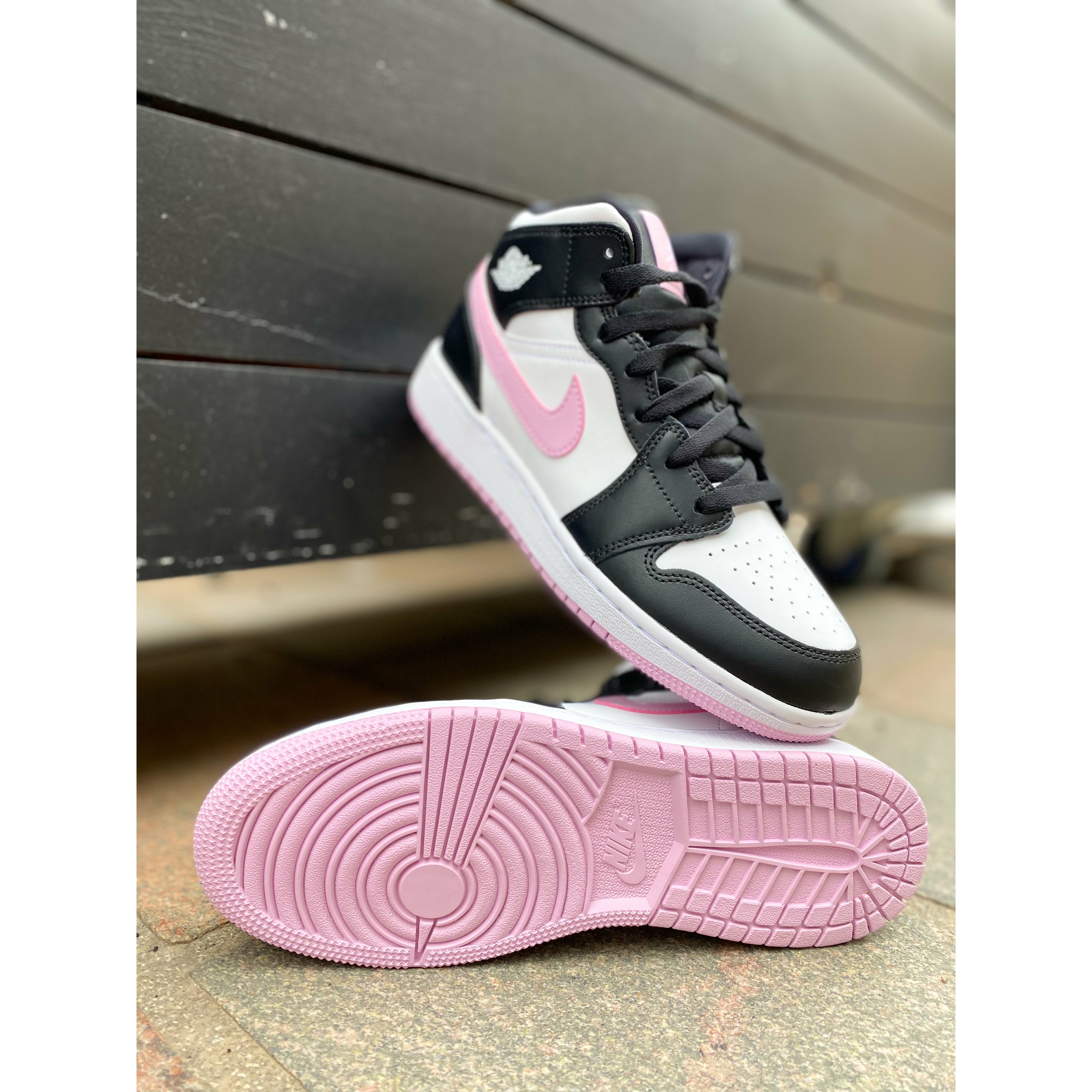 Black and store light pink jordans